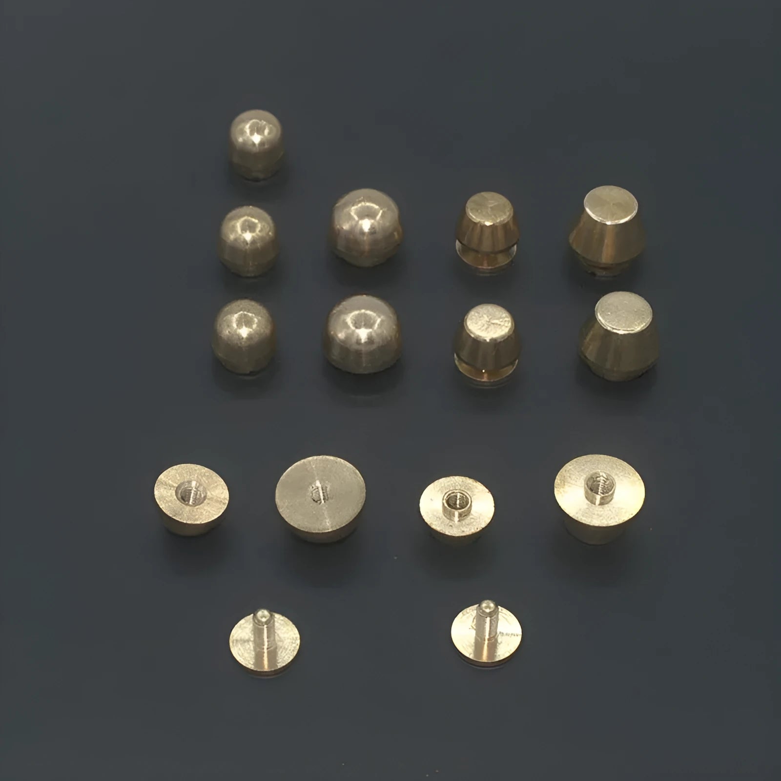 Brass decorative buckles showing round and bucket foot nail designs in 10x6mm and 12x7mm sizes