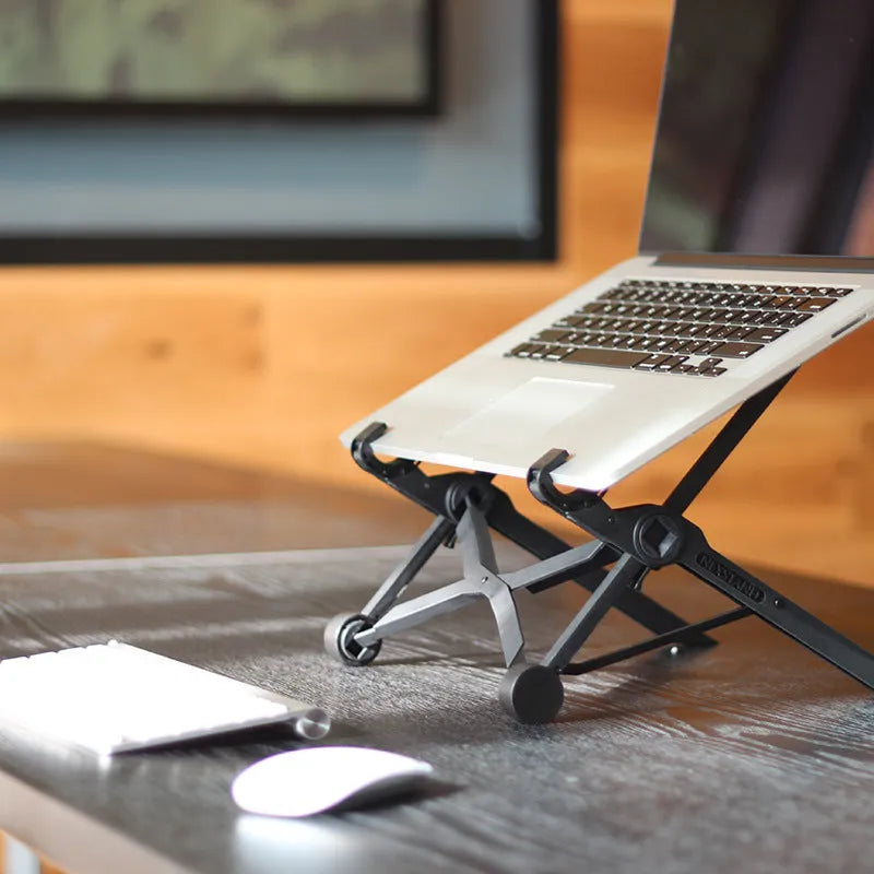 Black folding portable laptop stand showing reinforced nylon construction and compact 35.4cm design