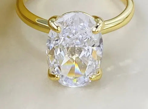 Oval 6x9mm gemstone ring with four-claw setting in gold or silver colour