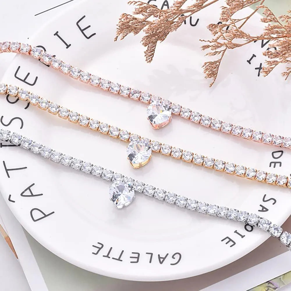 Gold heart-shaped rhinestone pet collar for dogs and cats with adjustable chain on a white background.