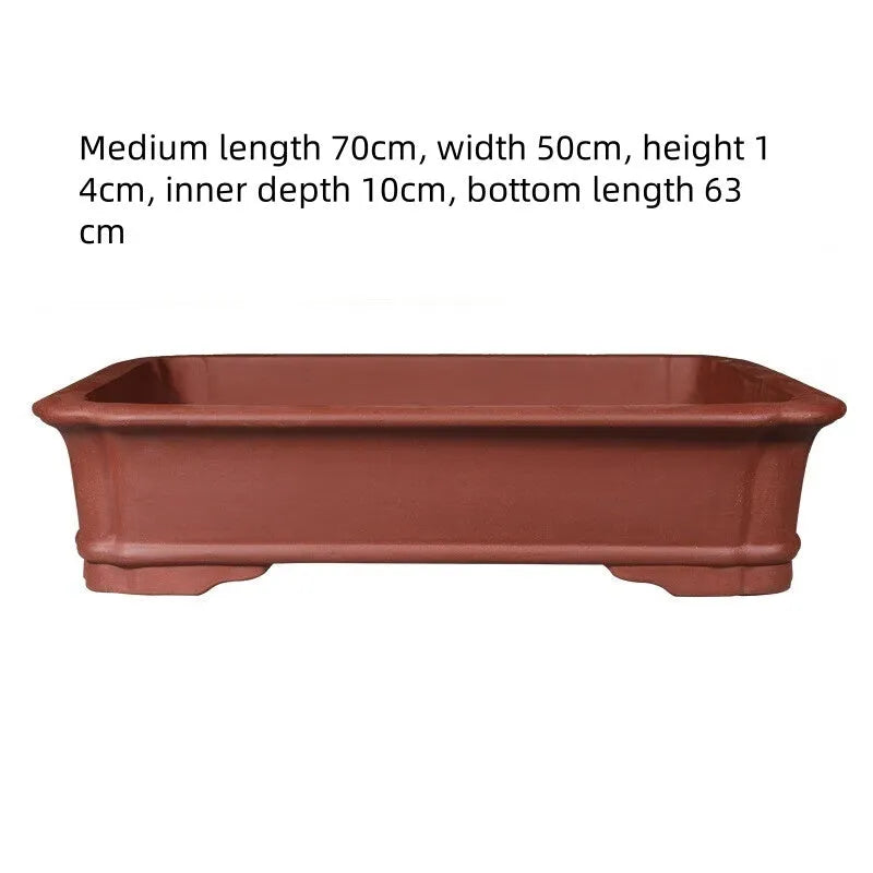 Large rectangular purple clay flowerpot showing handmade texture and substantial rectangular shape