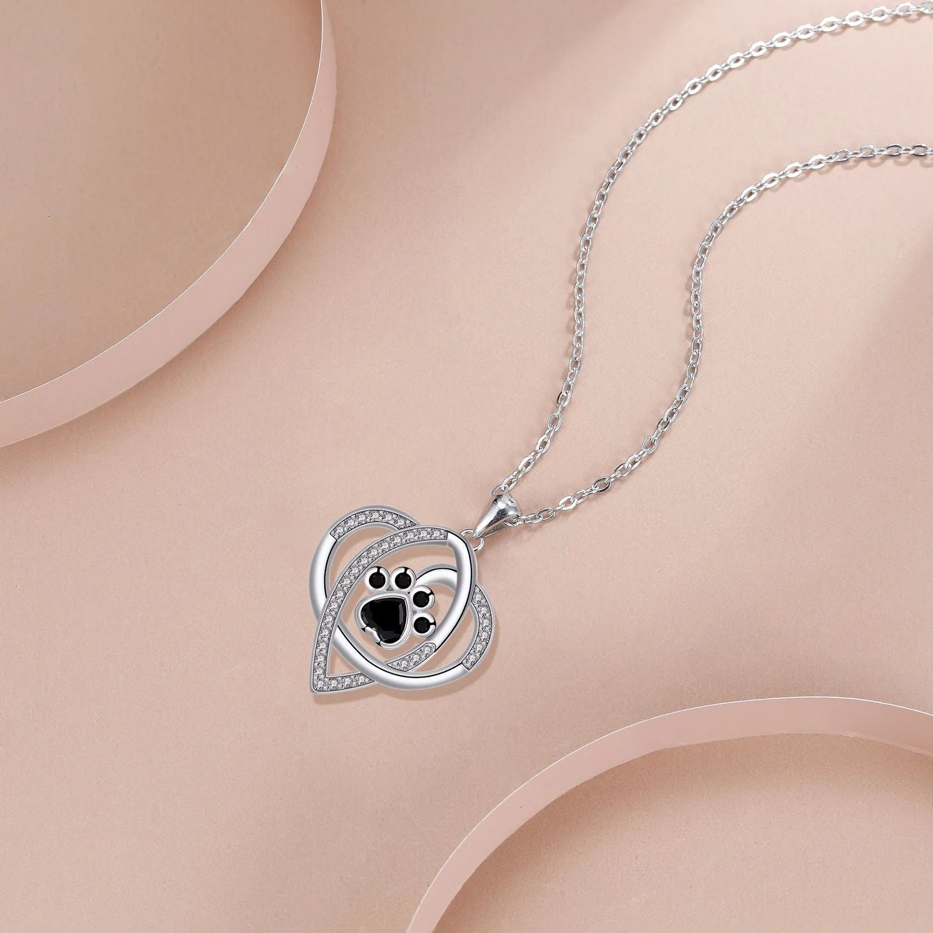 Copper pendant necklace with dog and cat paw prints on cross chain for women