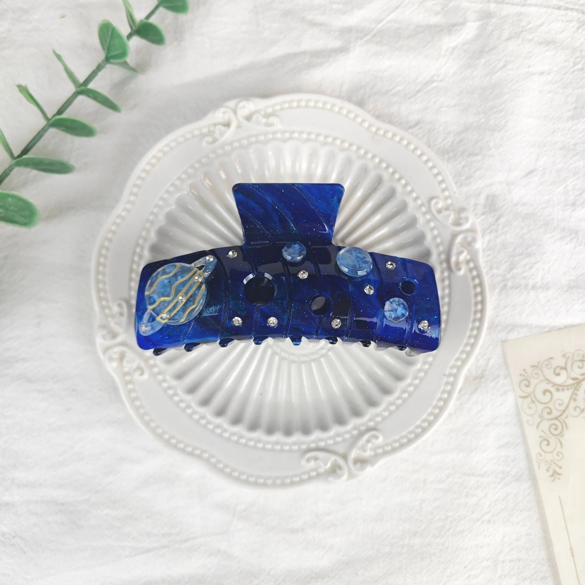 Oversized star moon barrette in celestial colours with irregular minimalist design