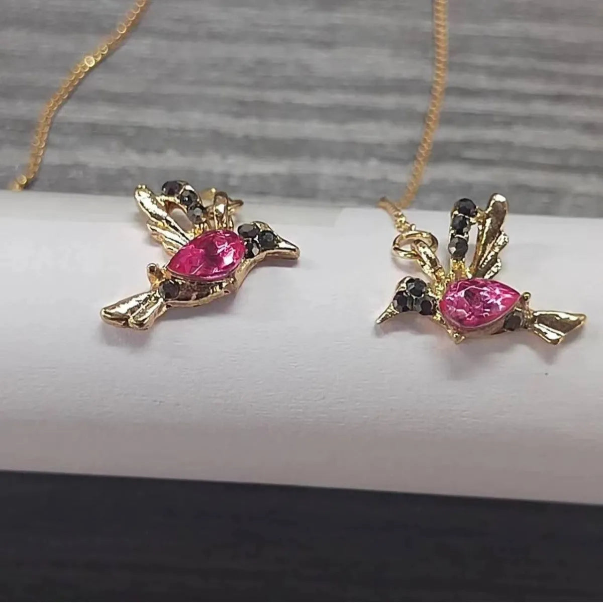 Long drop bird shaped alloy earrings for women with zirconium wings, shown in blue, red, and red lvzuan colour variations.