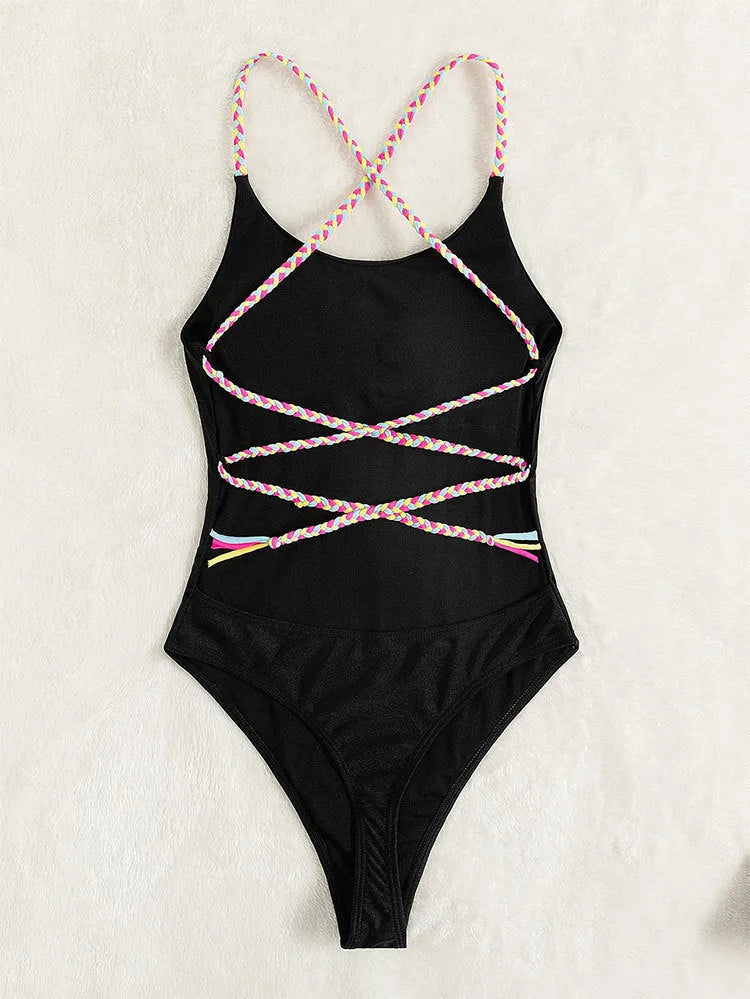 Black backless one-piece swimsuit for women made from nylon fabric.