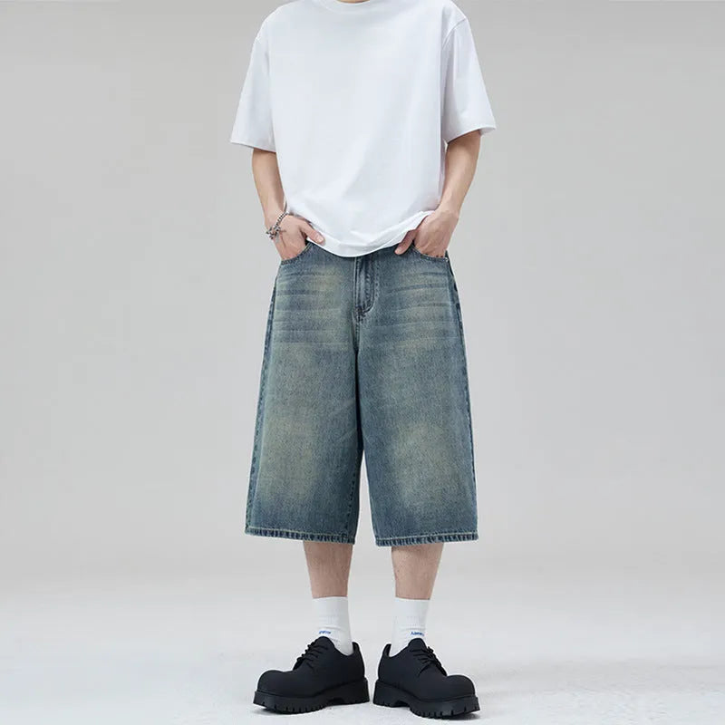 Men's light blue cotton denim loose-fit straight-leg summer shorts on a neutral background