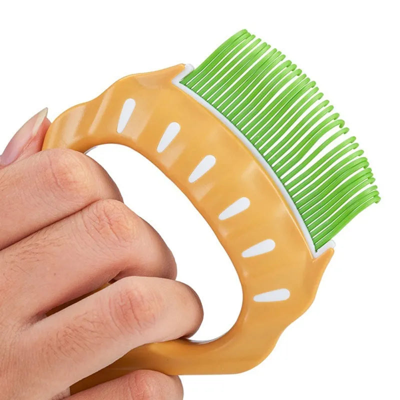 Shell-shaped plastic pet grooming comb with bent wire bristles and anti-slip handle in assorted colours.