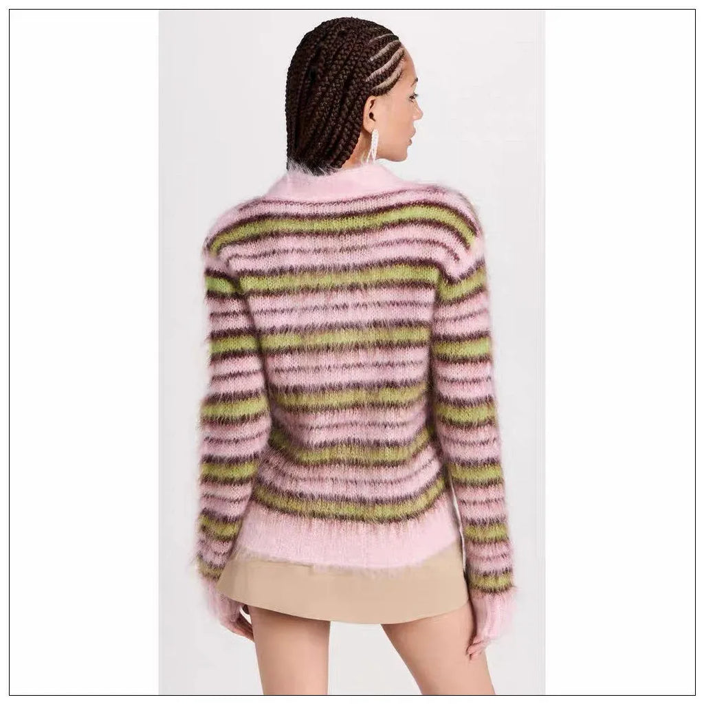 Pink wool lazy coat style cardigan sweater with contrast colour details on a hanger.