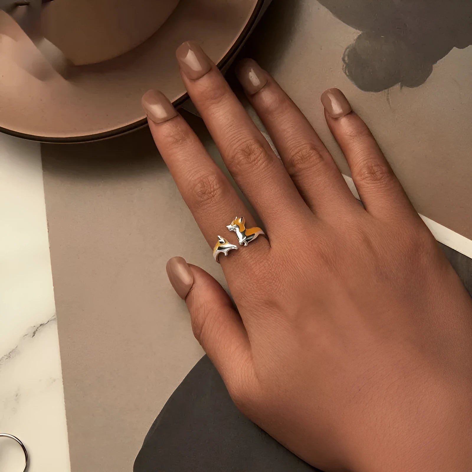 Silver ring with a raised cartoon corgi design in SCR1014-E electroplated colour.