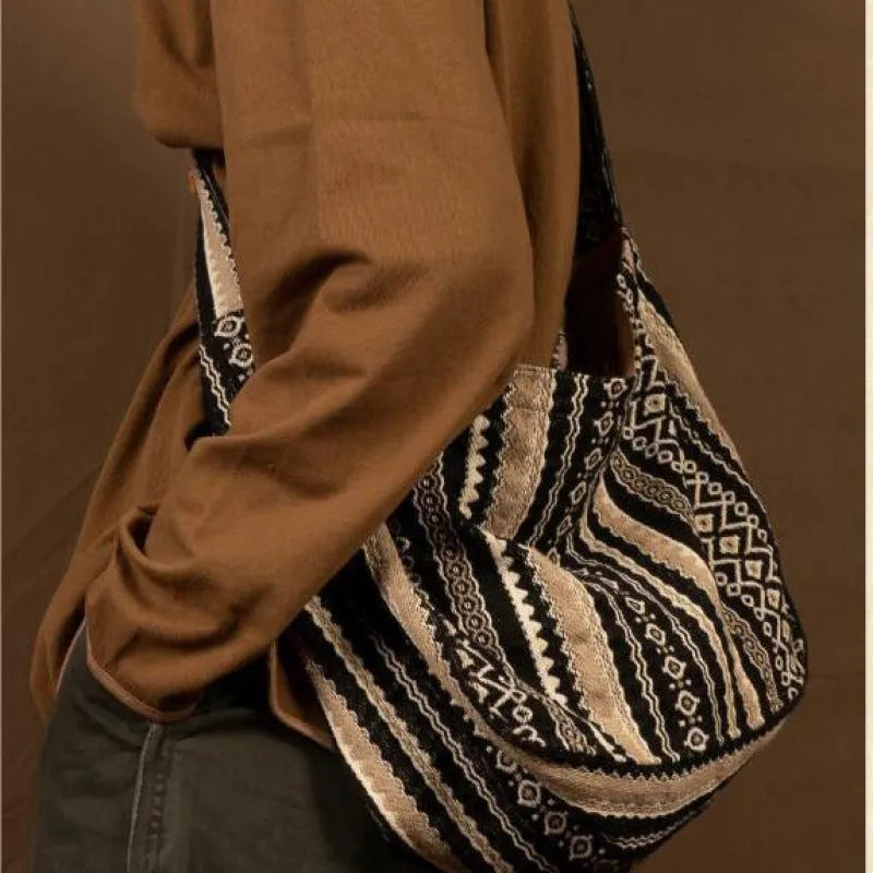 Retro striped corduroy messenger bag with adjustable plaid strap and zipper closure