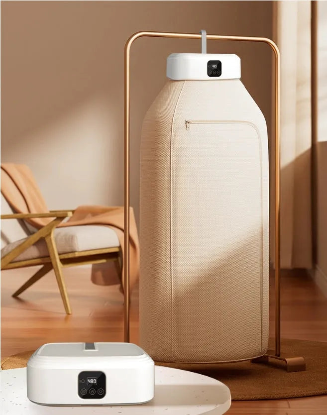 White cylindrical compact laundry dryer with remote control for small space drying