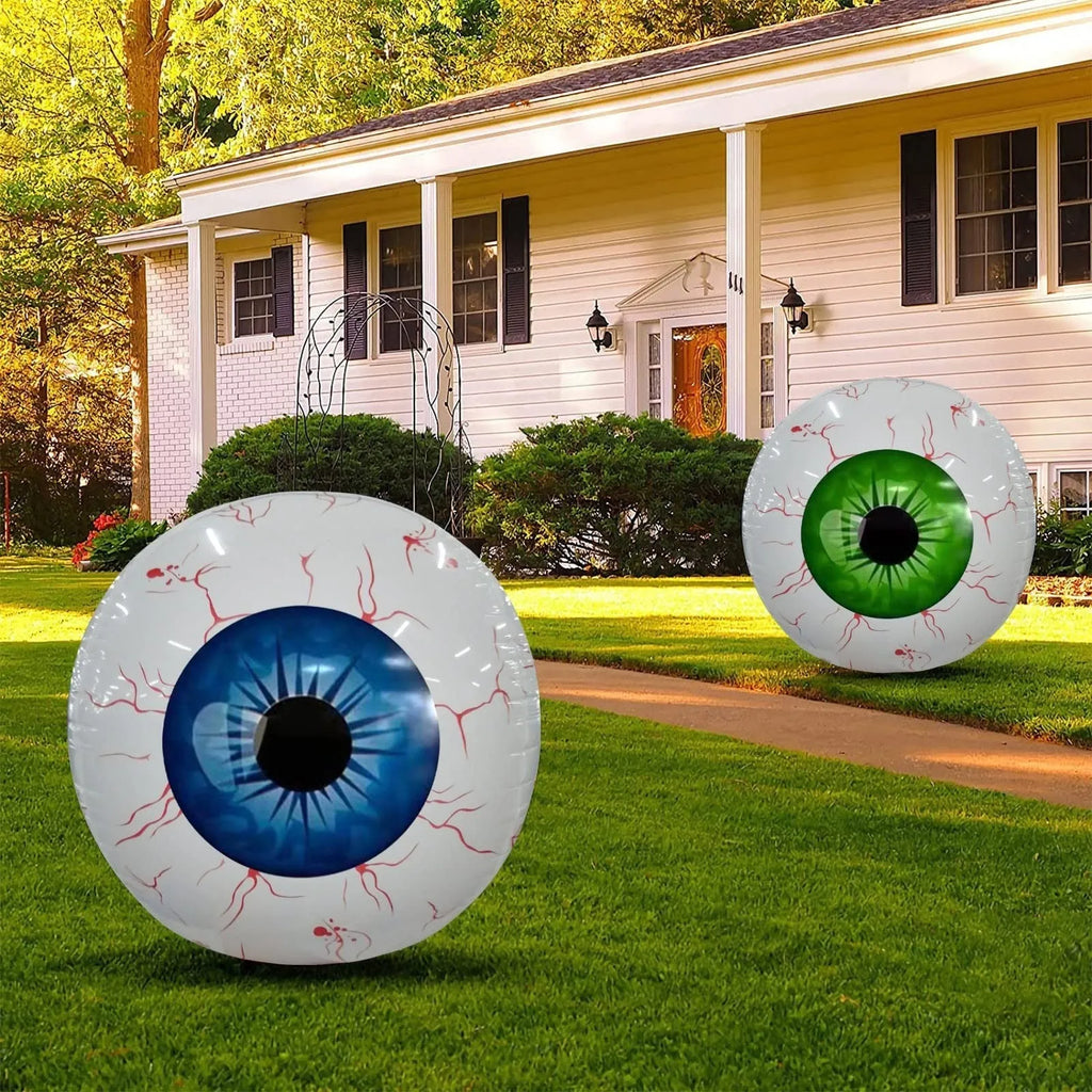 Green Halloween balloon with large bloodshot eyeball design, shown inflated