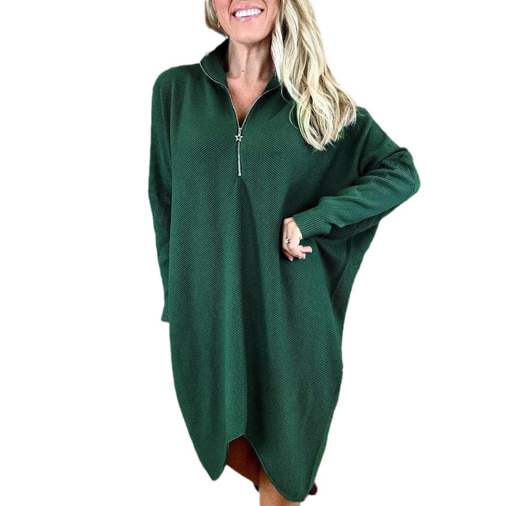 Women's solid colour loose fit knit dress with raglan sleeves on a hanger.