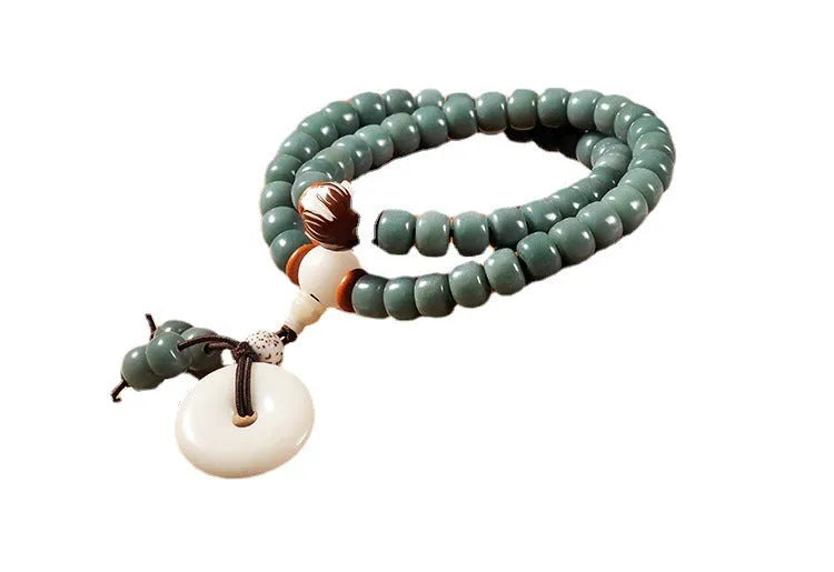White jade bodhi seed bracelet with green sandalwood tones and double ring safety buckle clasp