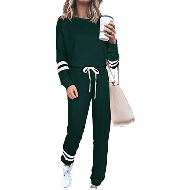 Women's plus size casual suit set in loose-fitting design with half-sleeve top and solid colour trousers
