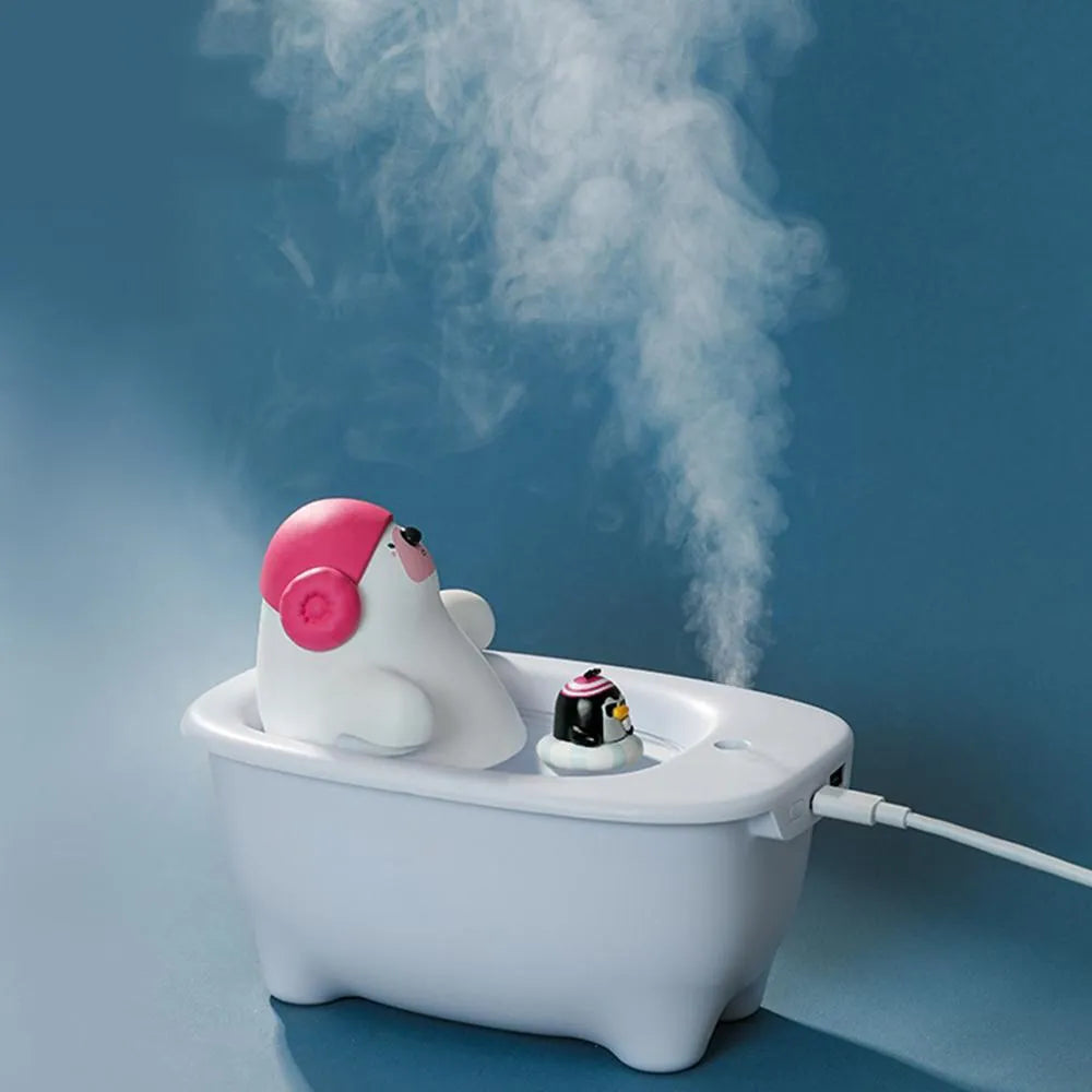 White Creative Air Humidifier with USB cable on a desk, showing its compact size and large water tank.
