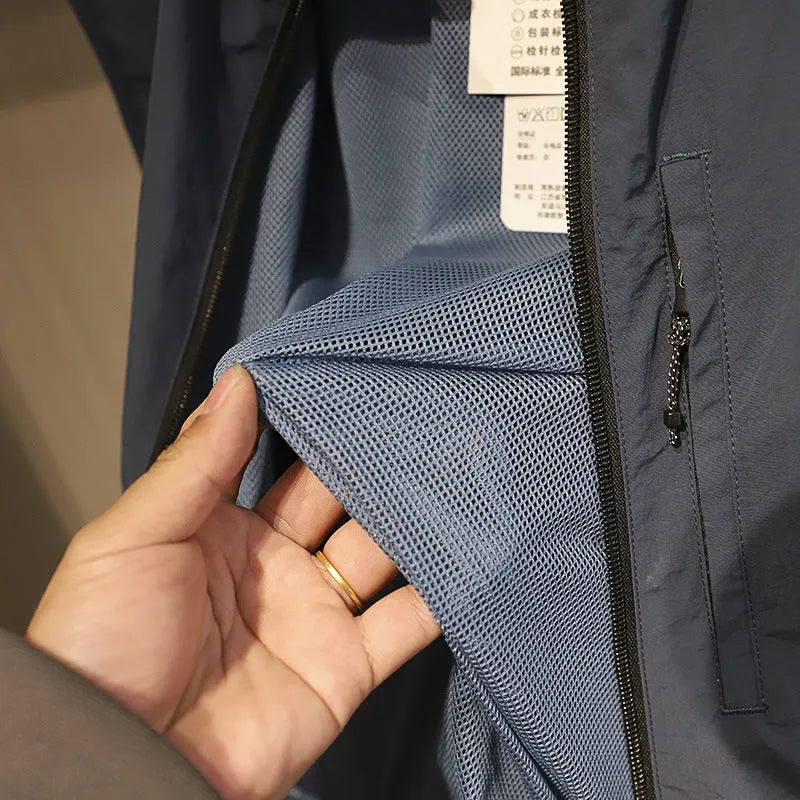 Men's straight cut nylon vest in army green with side seam pockets.
