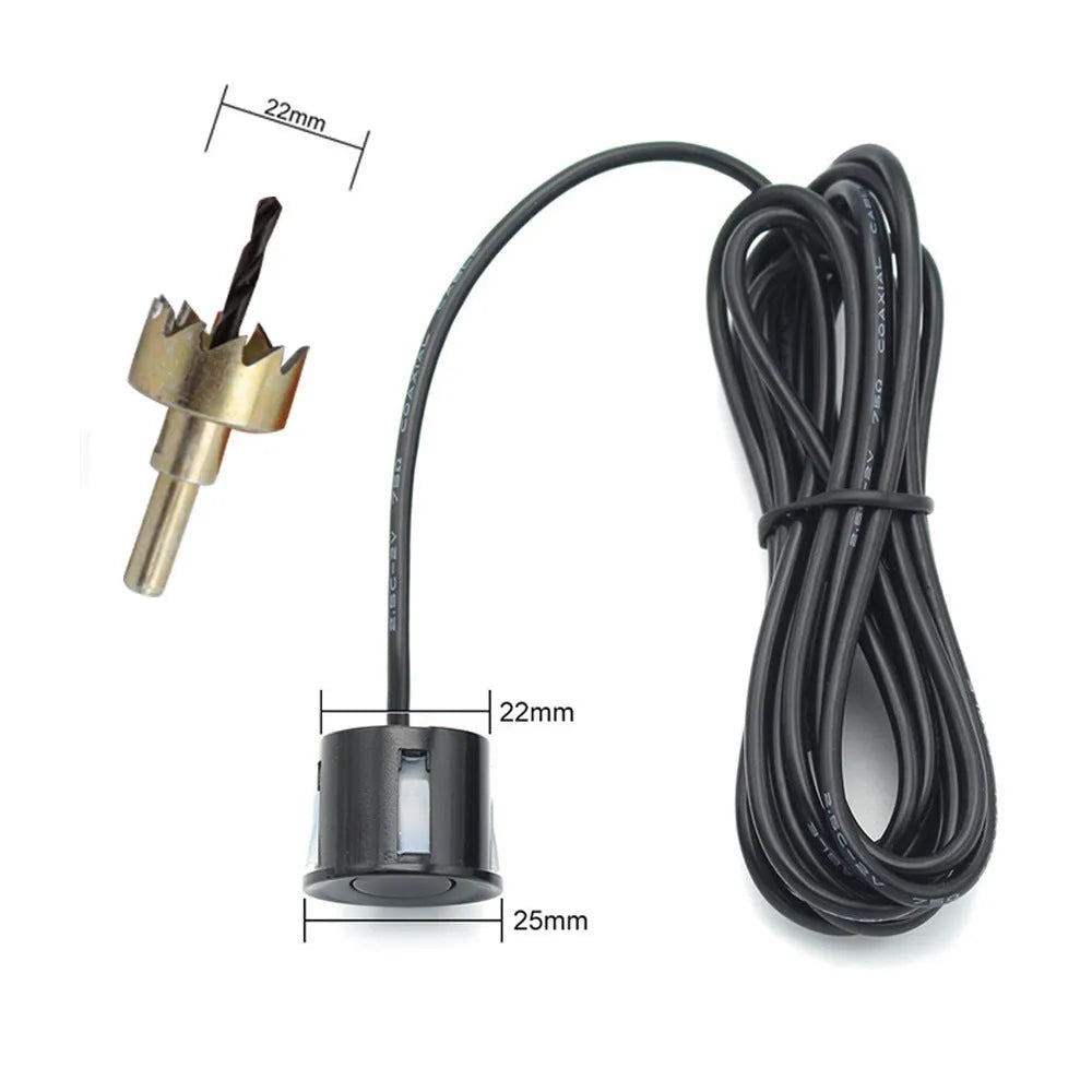Black wireless reversing sensor kit with digital display, four round probes, power cable, and installation tools.