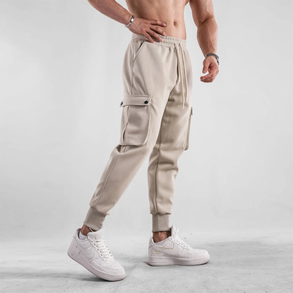 Men's loose cotton trousers with ankle tie fastening and multiple pockets in six colour options