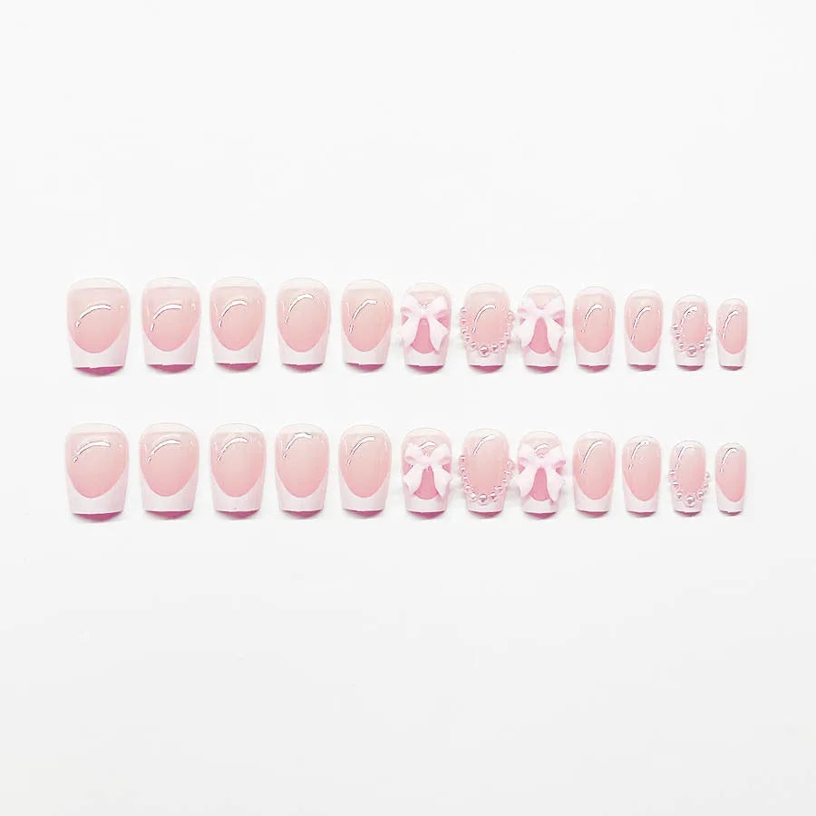 French manicure nail art set showing short white design with tulip, bow, starry sky, leopard print, and XINGX patterns
