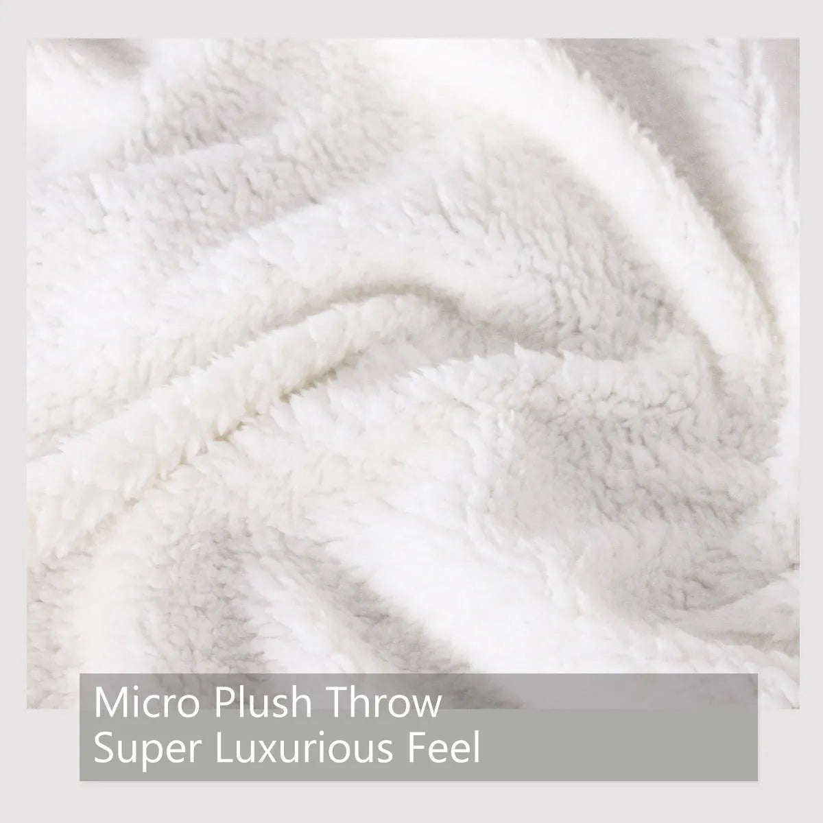 White Sherpa fleece blanket with tree leaf mushroom pattern, sized 130x150cm, on a sofa
