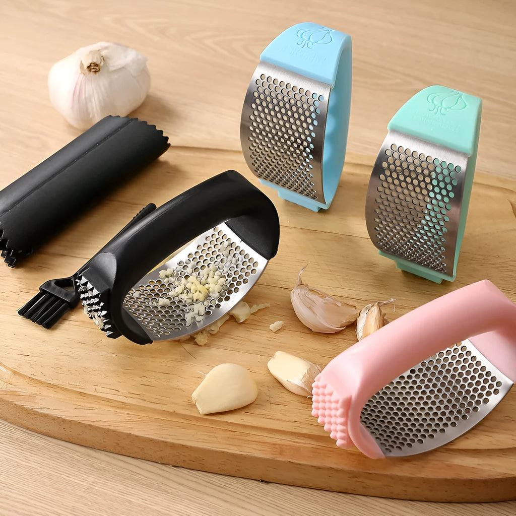 304 stainless steel garlic press in black, blue, green, and pink colour options on a kitchen counter