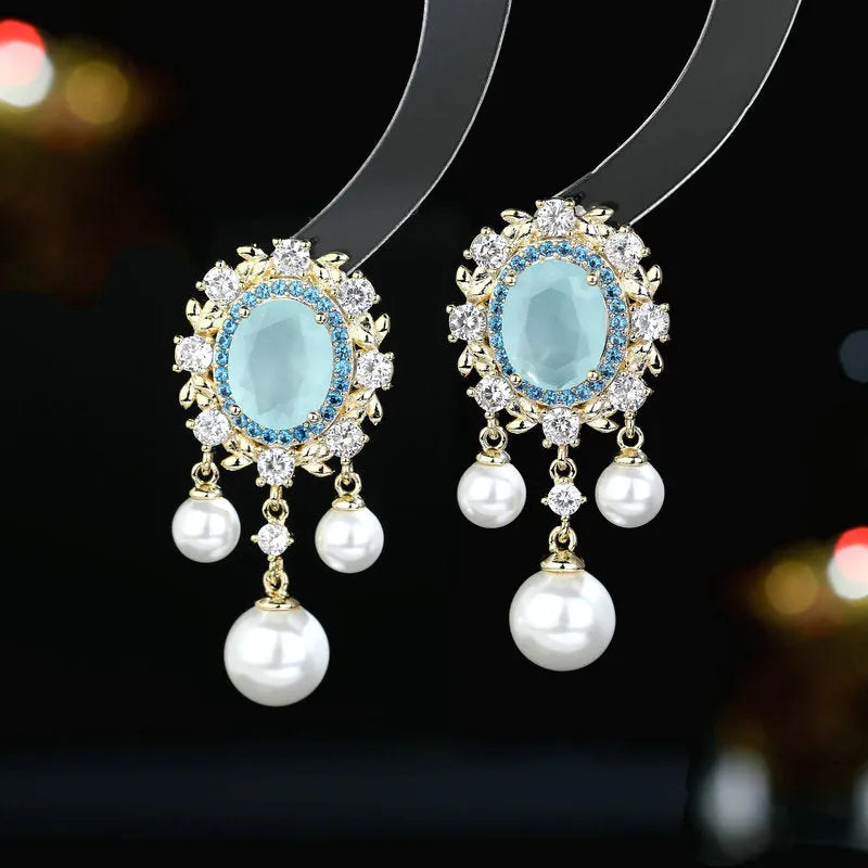 Copper oval earrings with zircon inlaid detail and pearl tassel pendant in light purple colour