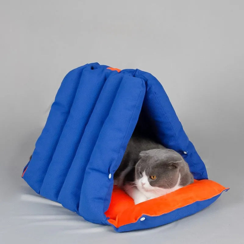 Blue triangular sofa-style cat bed with visible drill holes on the sides for connection.