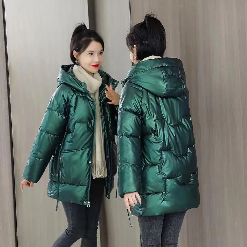 A women's loose-fit hooded winter jacket in a thick padded design, shown in one of four colour options.
