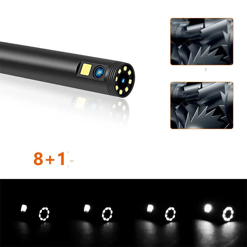 Wireless endoscope with dual-lens camera, magnet, and hook accessories on a table