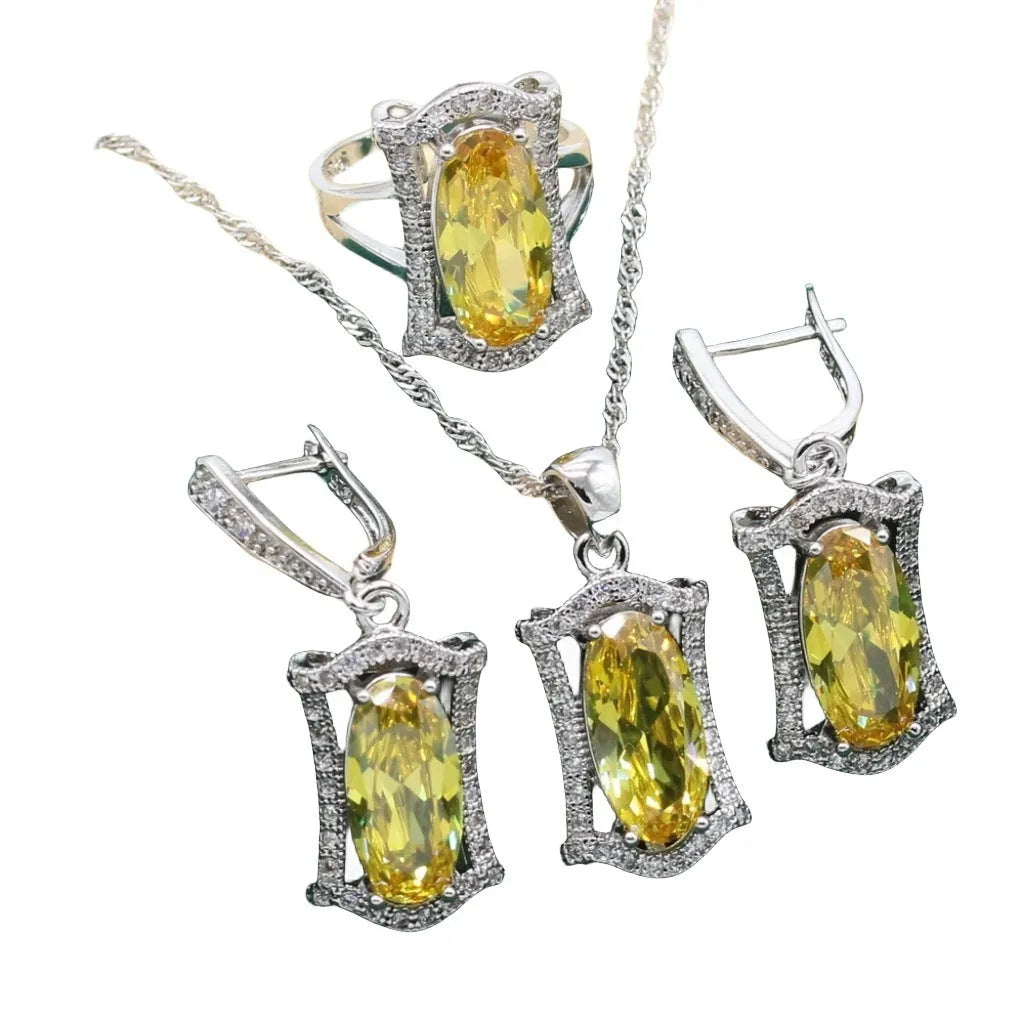 Yellow zircon jewellery set showing necklace with snake bones chain, matching earrings, ring, and bracelet on a white background.