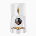 Black intelligent pet feeder with USB cable connection and food dispenser opening