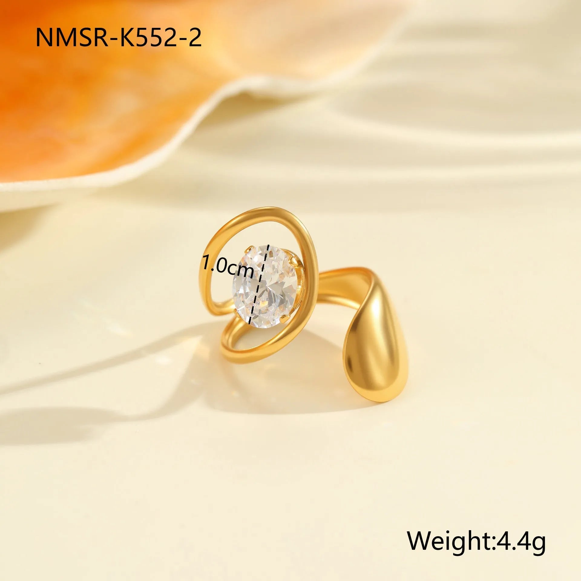 Women's geometric zircon ring with adjustable open mouth design on a hand.