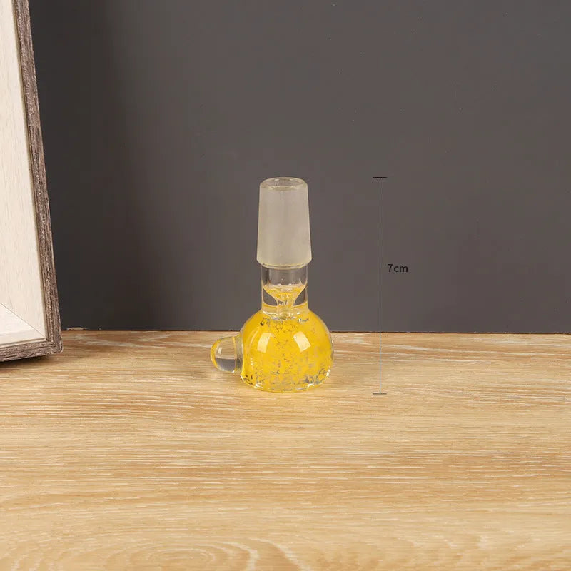 A 7cm long coloured glass trumpet-shaped cigarette holder on a plain background.