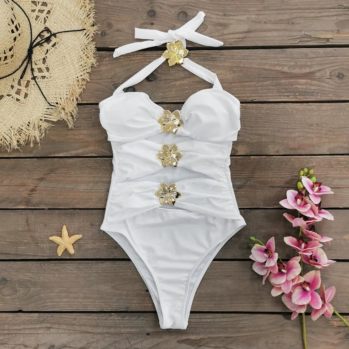 A solid colour one-piece swimsuit for women with a hollow-out tube top and a matching short skirt.