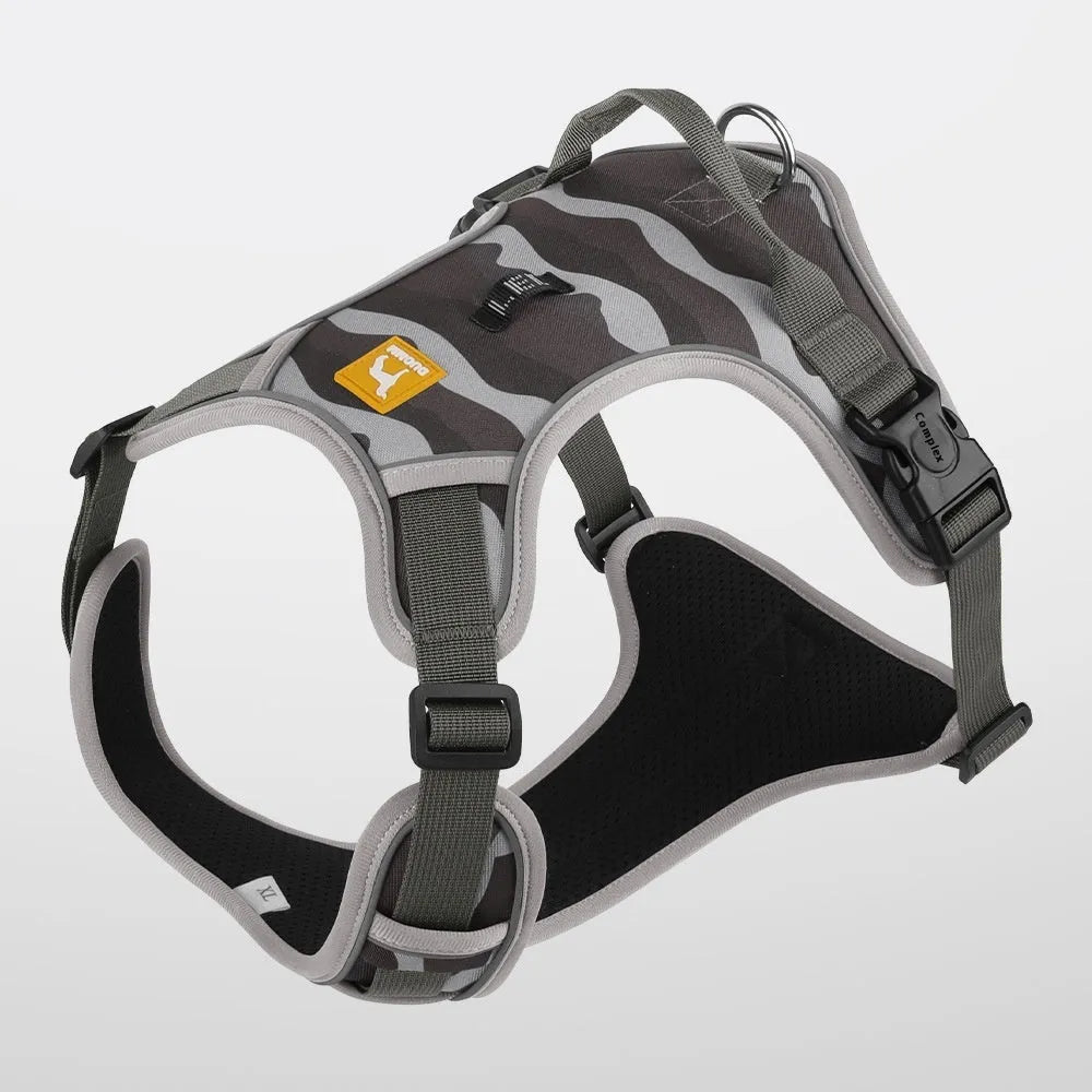Orange reflective dog chest and back harness with an attached hand-holding rope on a grey background.