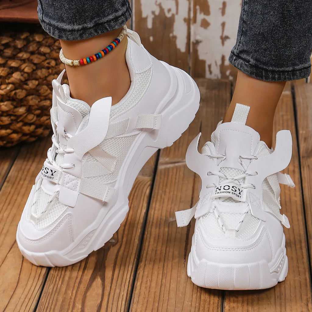 Women's purple platform mesh dad shoes with animal pattern and lace-up front.