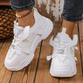 Women's purple platform mesh dad shoes with animal pattern and lace-up front.
