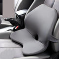 Memory foam car waist pad and headrest combination in a neutral colour for lumbar support.