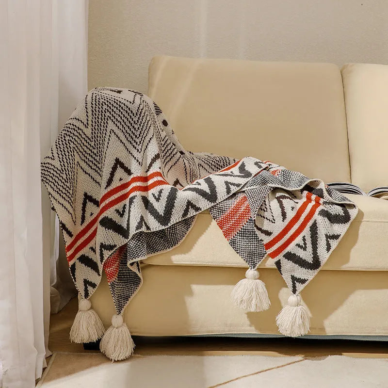 Bohemian-style acrylic sofa blanket with tassel edges in geometric pattern or solid colour options