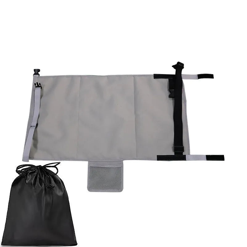 Blue portable children's aircraft seat extender with attached pedal and matching drawstring storage pocket.