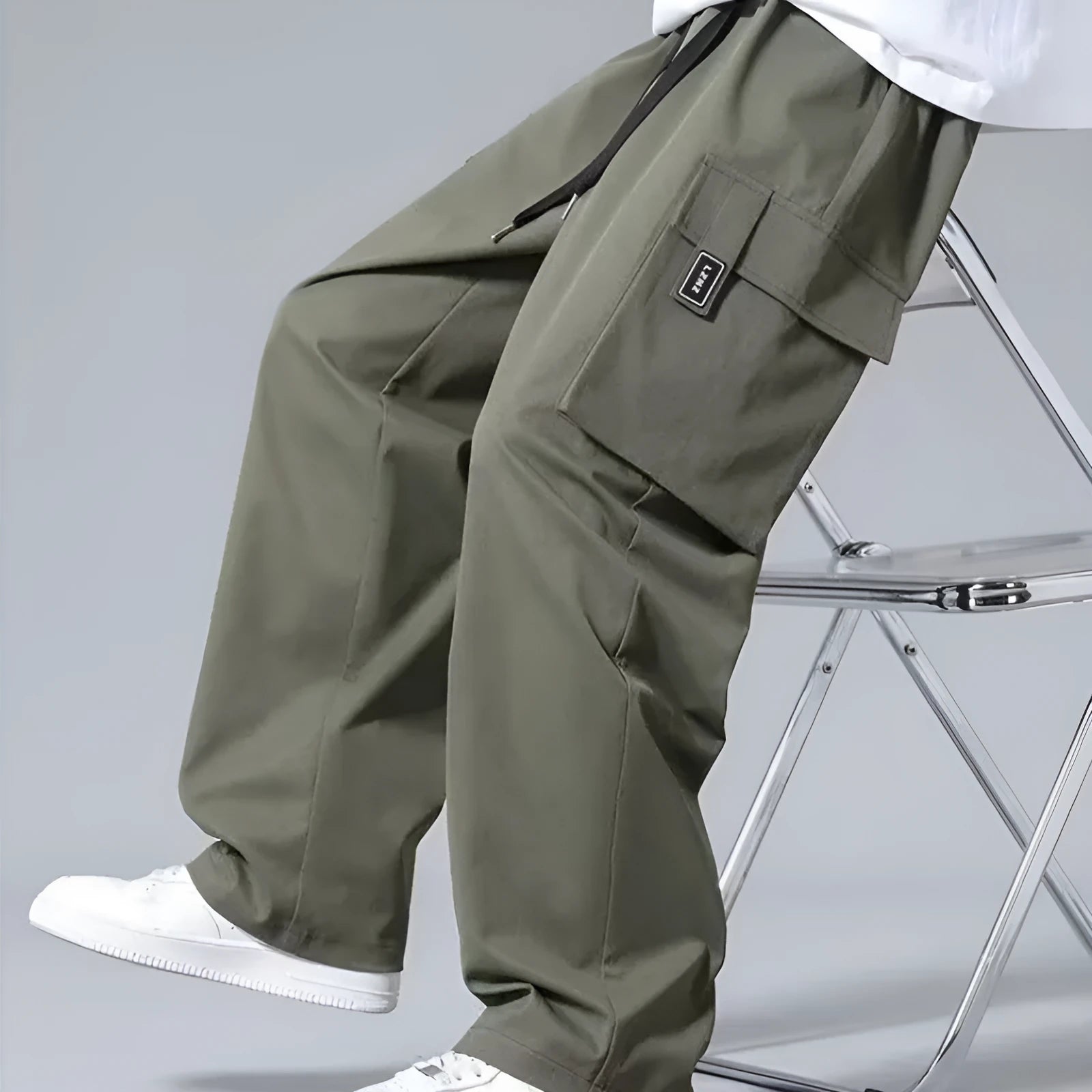 Boys in straight-leg cargo pants with drawstring waist and large side pockets, shown in army green.