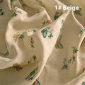 Roll of beige, grass green and dark green 100% ramie fabric for Hanfu sewing and embroidery, showing texture.
