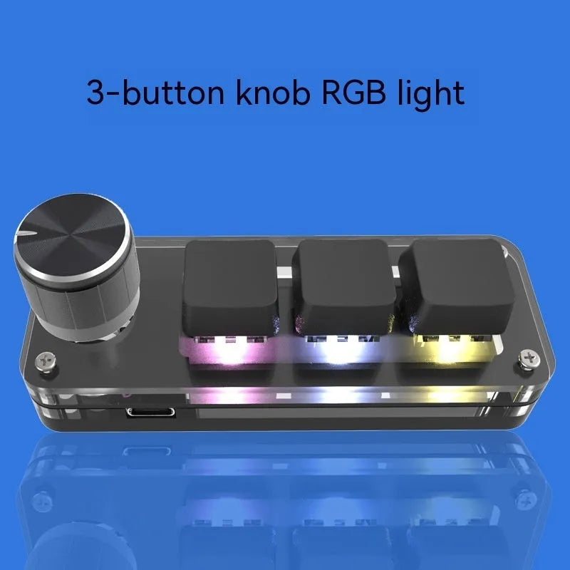 Black programmable mini keyboard with RGB backlit keys showing copy and paste shortcuts
