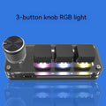 Black programmable mini keyboard with RGB backlit keys showing copy and paste shortcuts