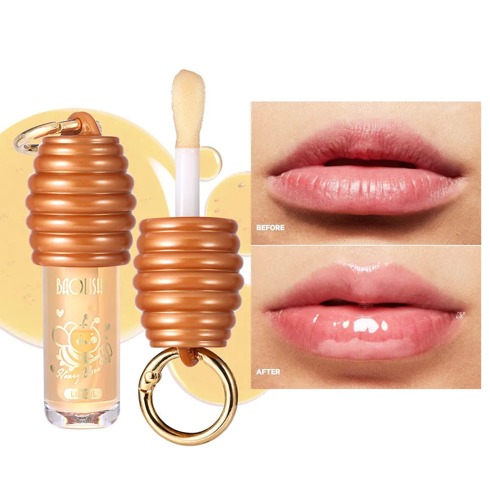 Honey lip gloss in portable keychain container for moisturising lip care