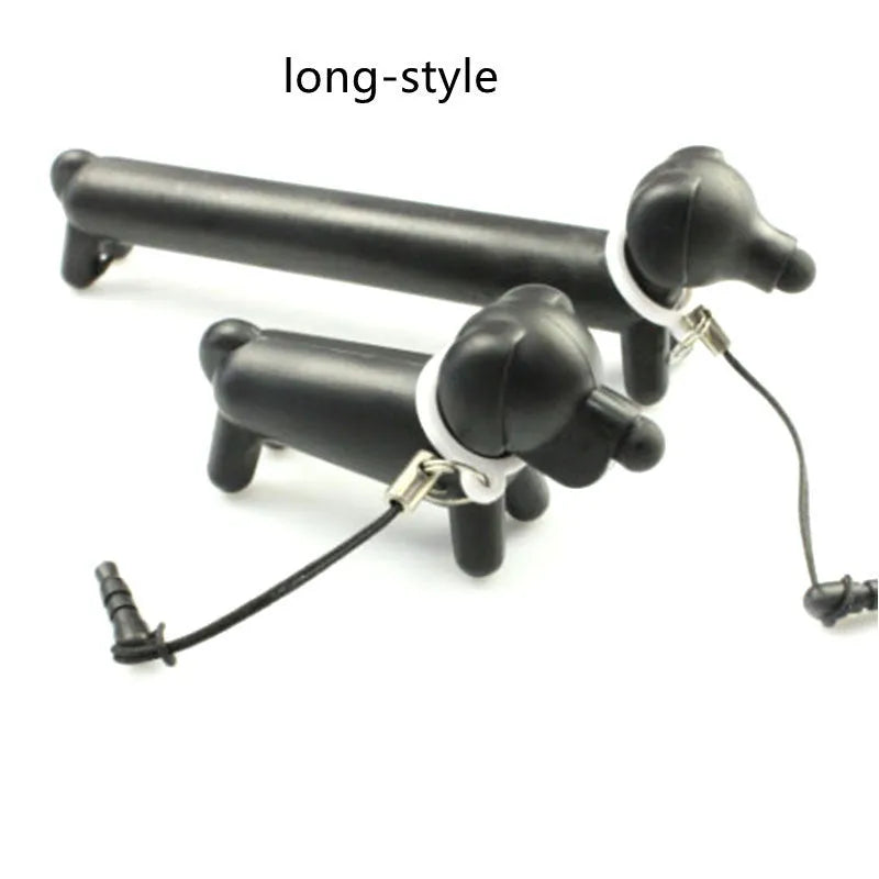 Black dog-shaped touch screen stylus with conductive body shown next to smartphone demonstrating phone holder function