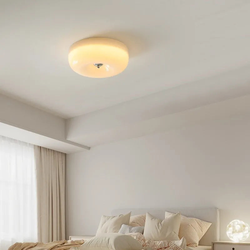 Cream coloured American style bedroom ceiling light with a three-colour lighting system.