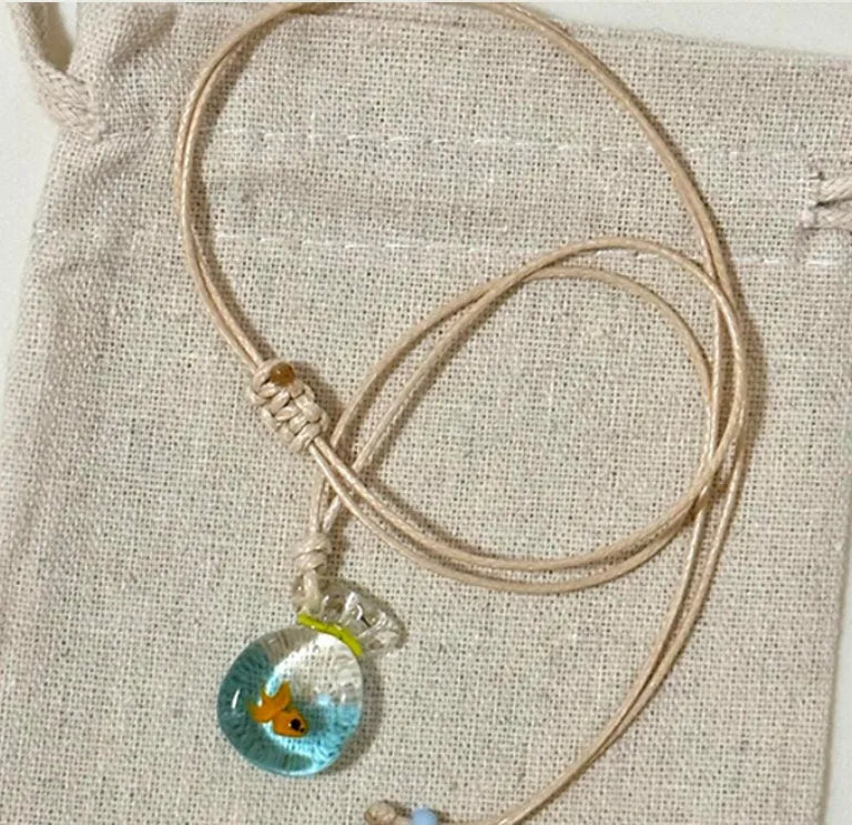 Women's necklace with coloured glaze skirt joker pendant on cotton linen clavicle chain