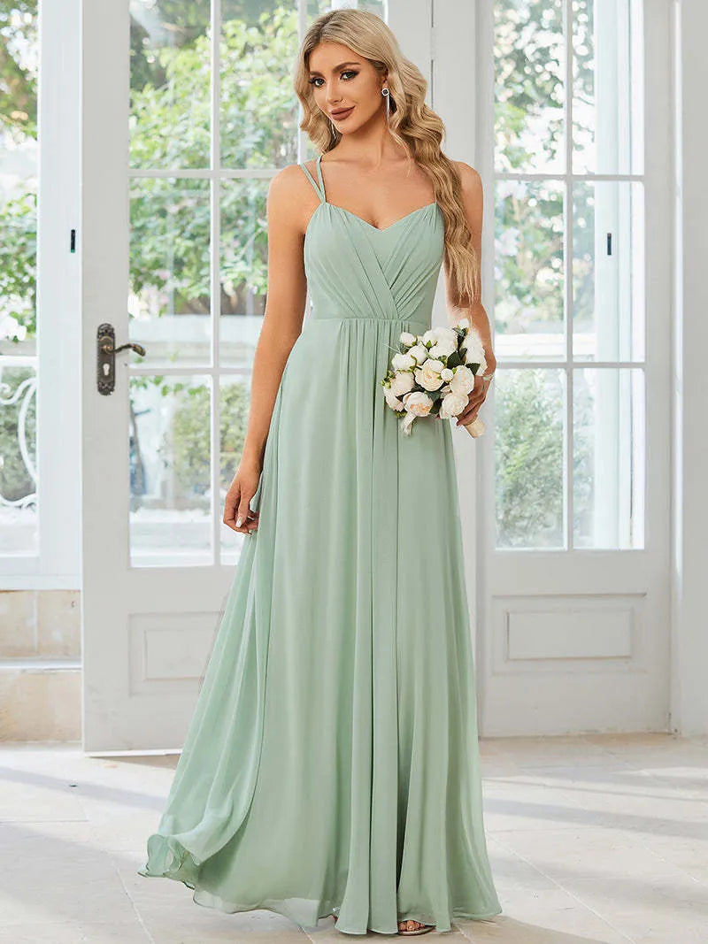 Women's sleeveless pleated A-line long dress in light green, shown in a solid colour with a long skirt.
